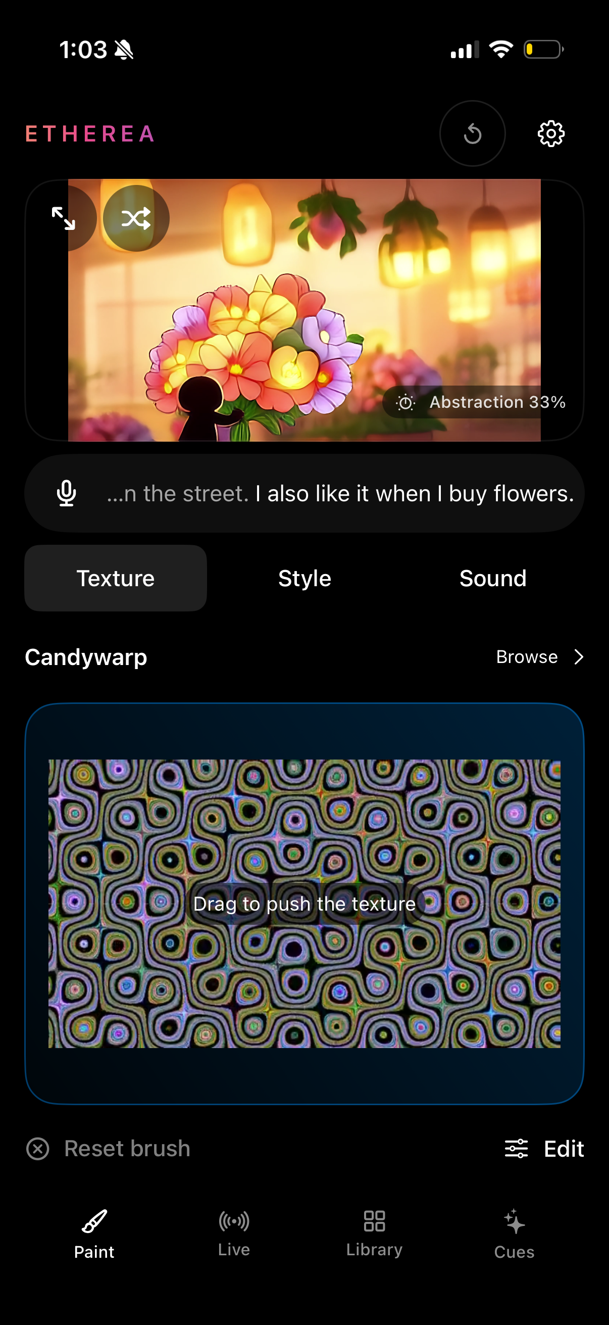 The actual ETHEREA iPhone app shown in a hand-held phone: a floral painting, speech transcript, live texture controls, and Paint, Live, Library and Cues navigation.